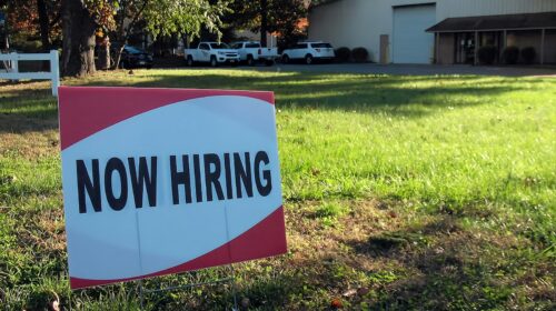 A now hiring sign outside a business